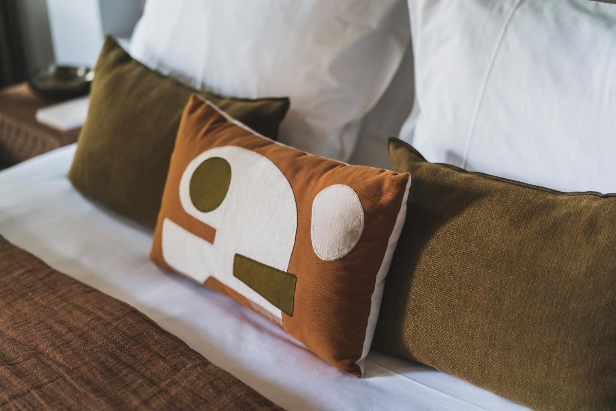 Un ou plusieurs lits dans un hébergement de l'établissement Les Lodges Sainte-Victoire Hotel & Spa
