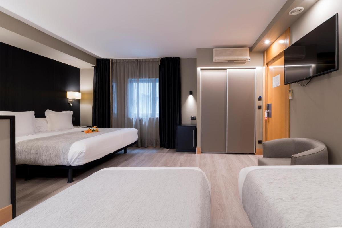 Cama o camas de una habitación en Hotel Plaza