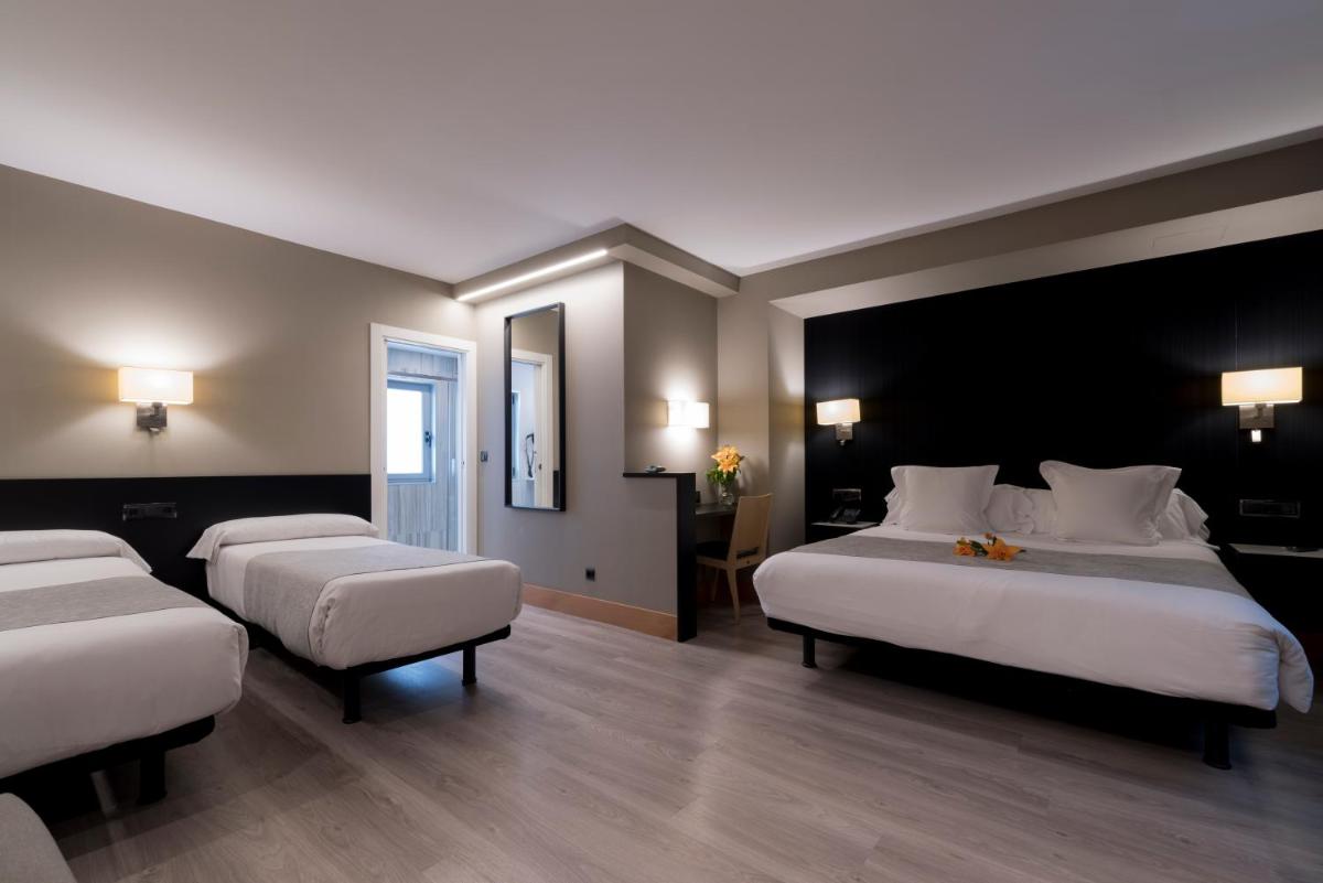 Cama o camas de una habitación en Hotel Plaza