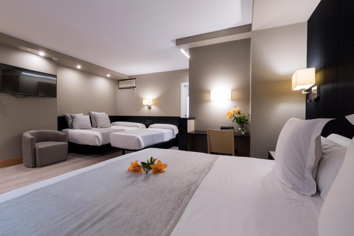Cama o camas de una habitación en Hotel Plaza