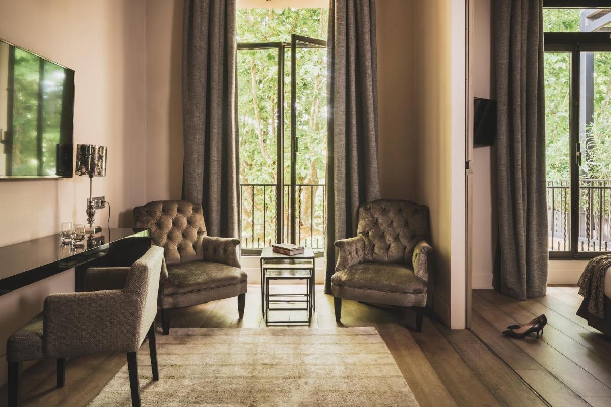 Coin salon dans l'établissement Les Lodges Sainte-Victoire Hotel & Spa