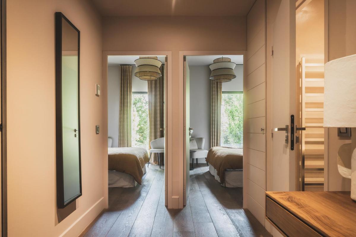Un ou plusieurs lits dans un hébergement de l'établissement Les Lodges Sainte-Victoire Hotel & Spa