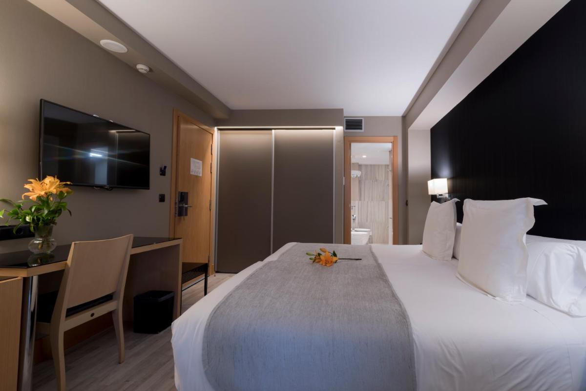 Cama o camas de una habitación en Hotel Plaza