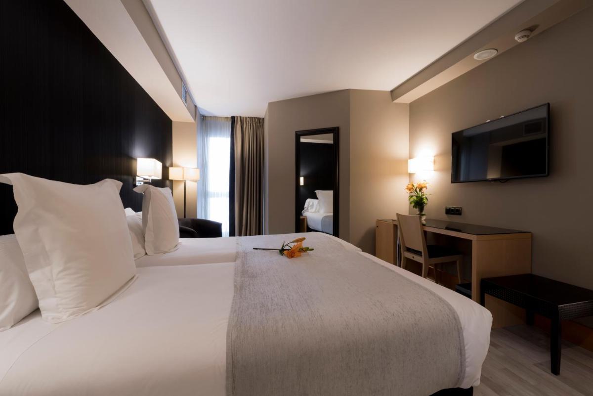 Cama o camas de una habitación en Hotel Plaza