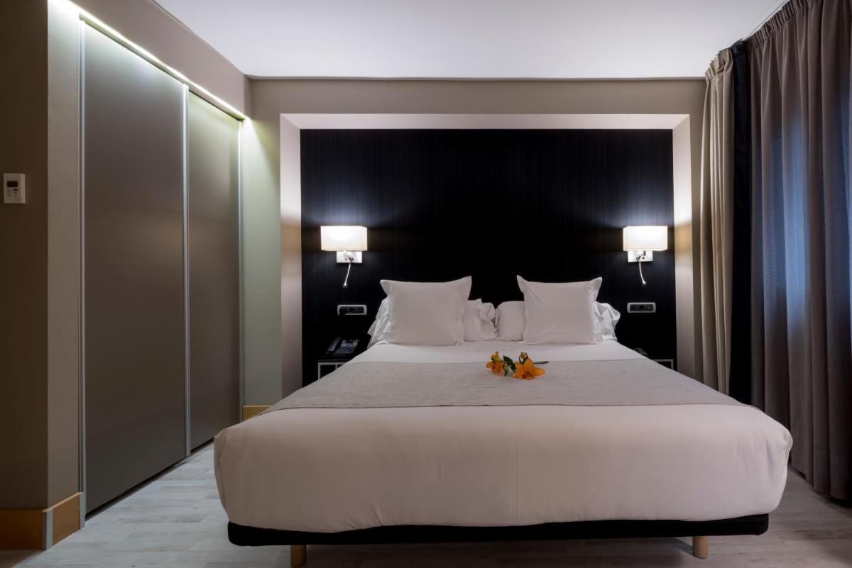 Cama o camas de una habitación en Hotel Plaza