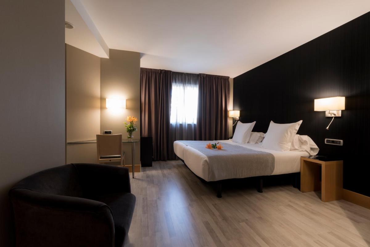 Cama o camas de una habitación en Hotel Plaza