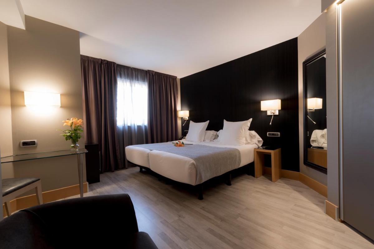 Cama o camas de una habitación en Hotel Plaza