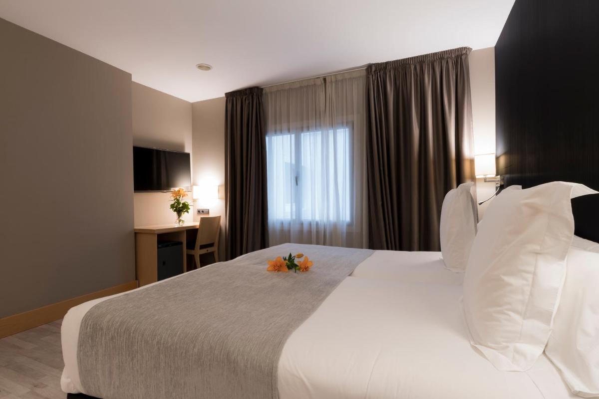 Cama o camas de una habitación en Hotel Plaza