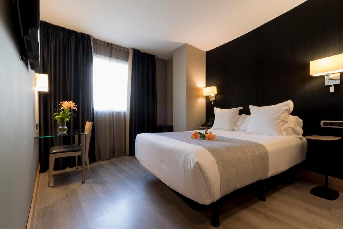 Cama o camas de una habitación en Hotel Plaza