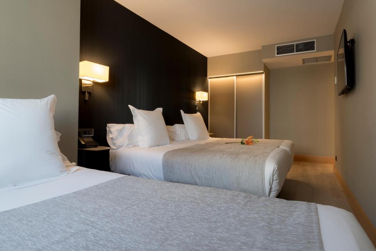 Cama o camas de una habitación en Hotel Plaza
