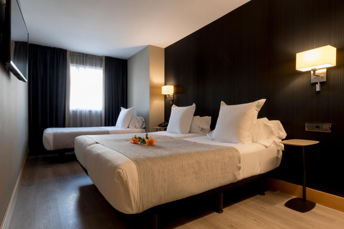 Cama o camas de una habitación en Hotel Plaza