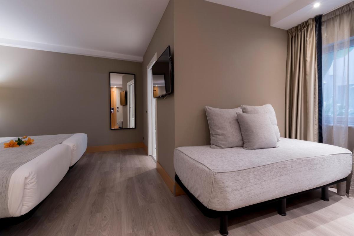 Cama o camas de una habitación en Hotel Plaza