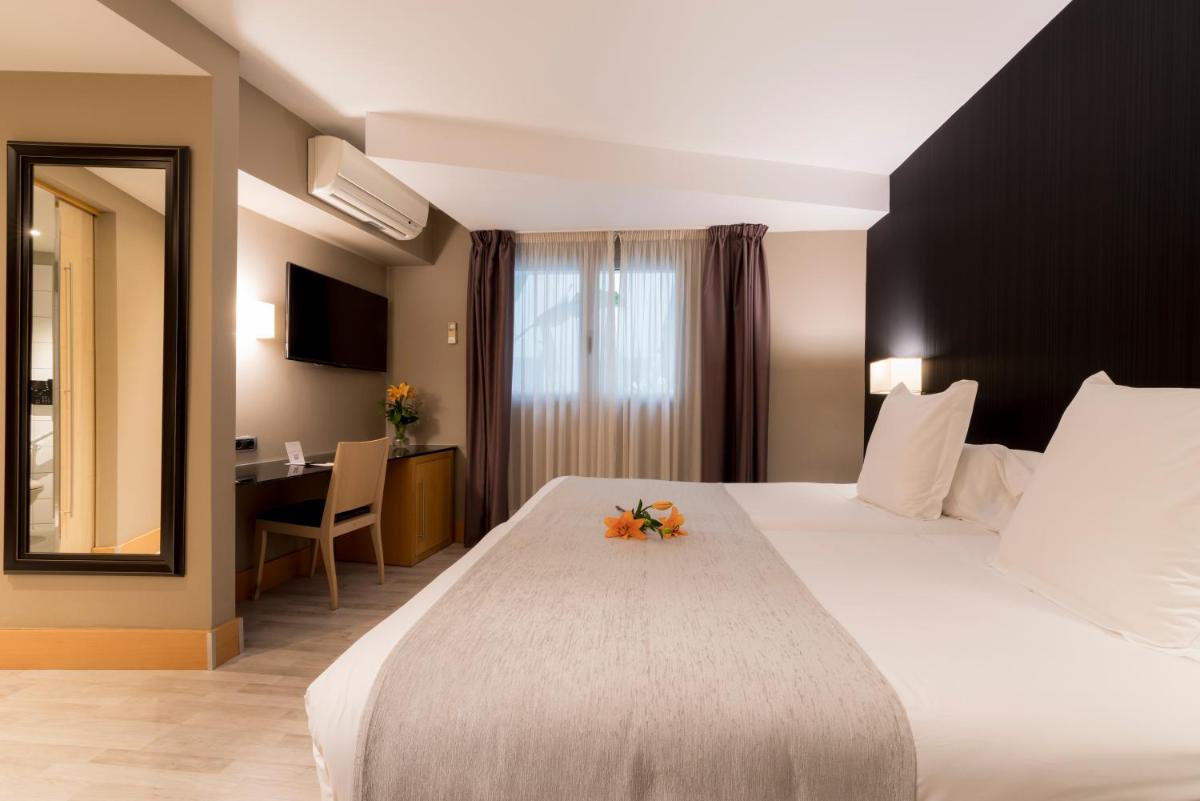 Cama o camas de una habitación en Hotel Plaza