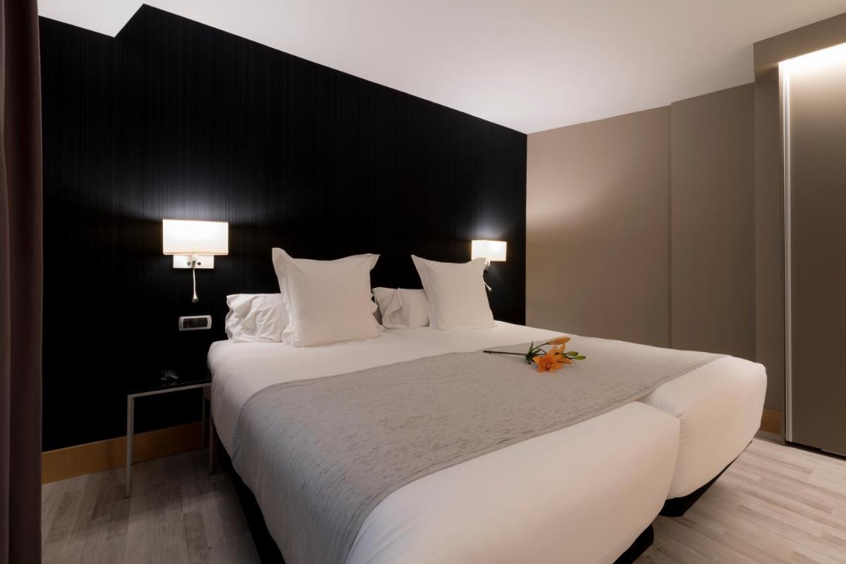 Cama o camas de una habitación en Hotel Plaza