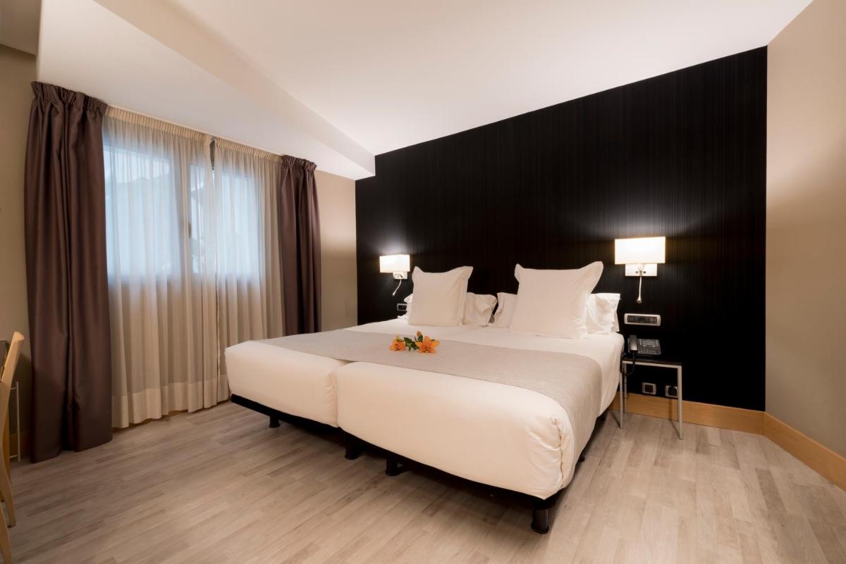 Cama o camas de una habitación en Hotel Plaza