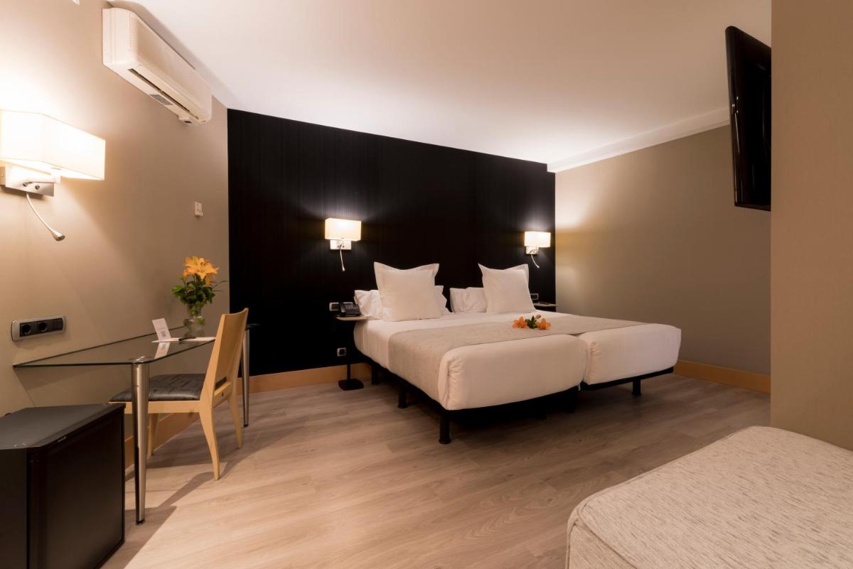 Cama o camas de una habitación en Hotel Plaza