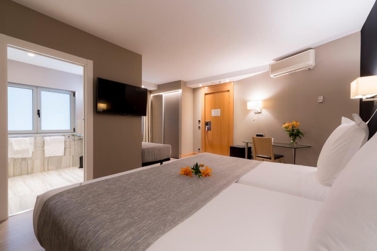 Cama o camas de una habitación en Hotel Plaza