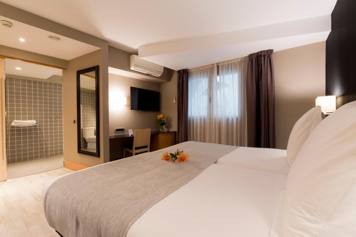 Cama o camas de una habitación en Hotel Plaza