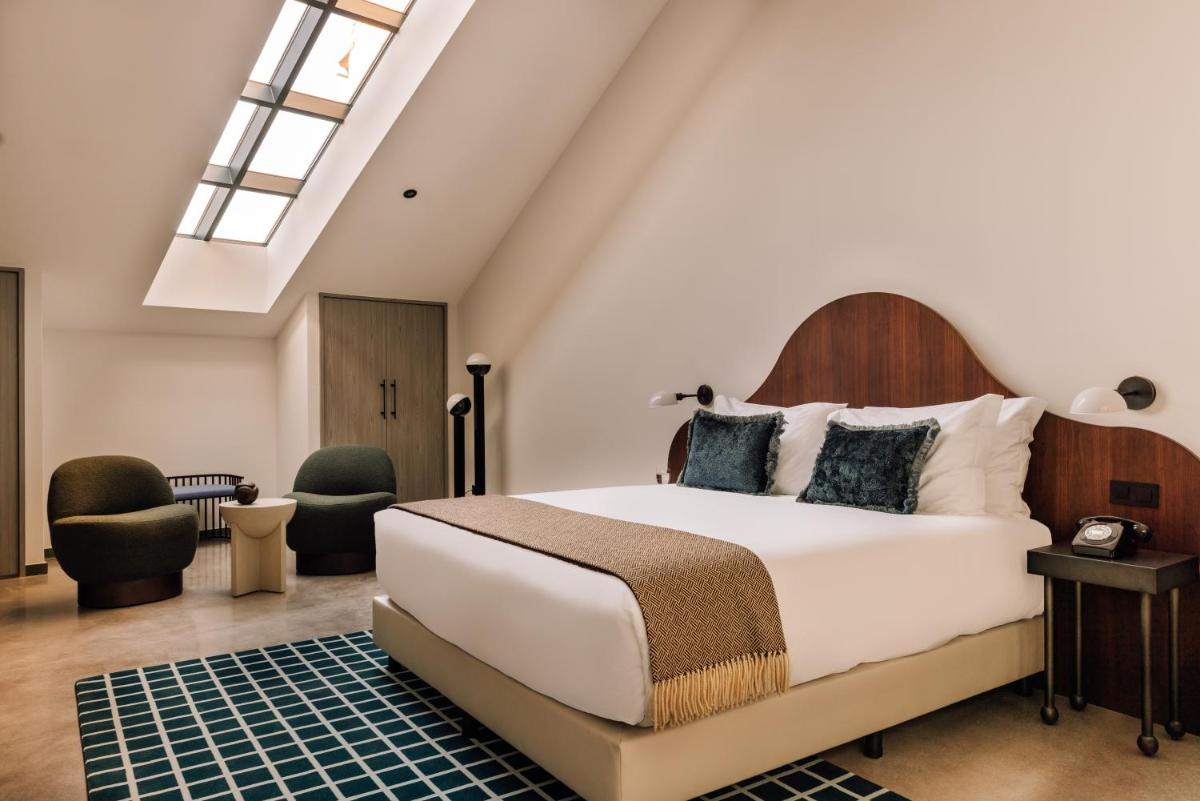 Uma cama ou camas num quarto em The Rebello Hotel & Spa - Small Luxury Hotels Of The World