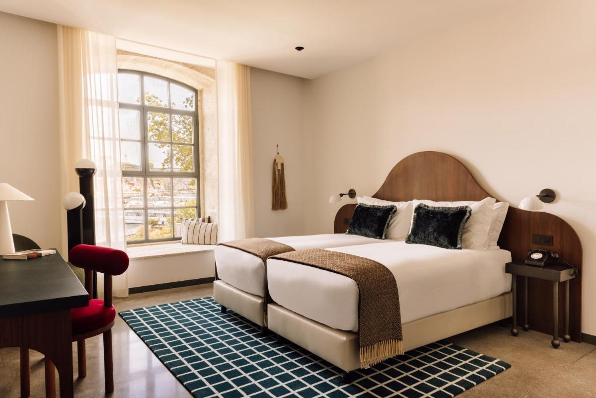 Uma cama ou camas num quarto em The Rebello Hotel & Spa - Small Luxury Hotels Of The World