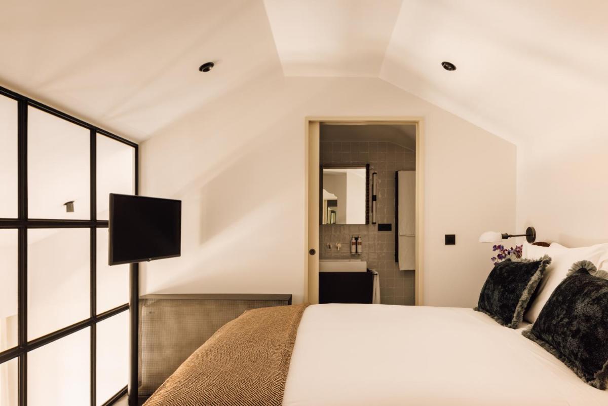 Uma cama ou camas num quarto em The Rebello Hotel & Spa - Small Luxury Hotels Of The World