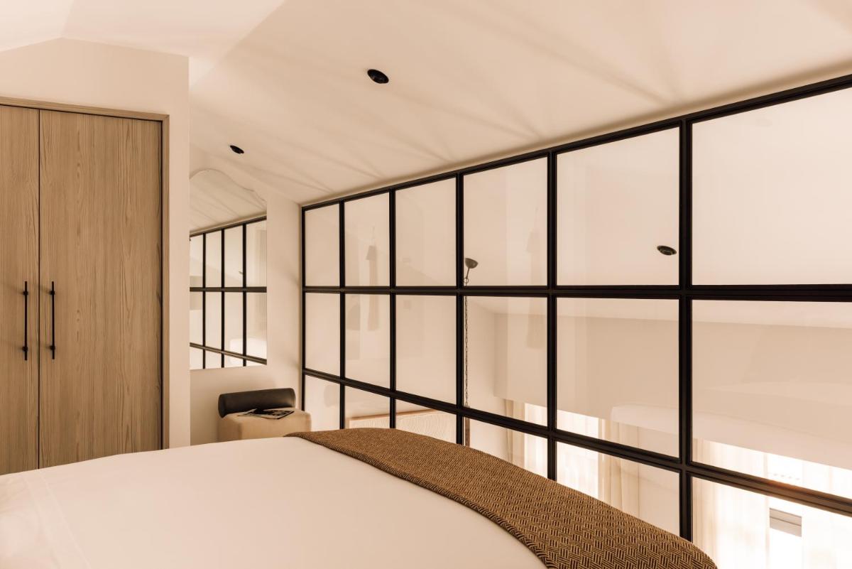 Uma cama ou camas num quarto em The Rebello Hotel & Spa - Small Luxury Hotels Of The World