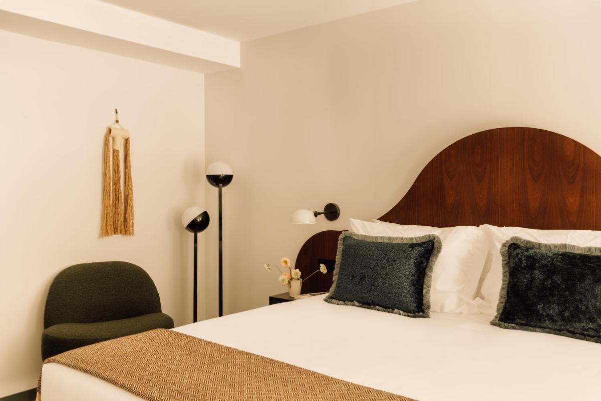 Uma cama ou camas num quarto em The Rebello Hotel & Spa - Small Luxury Hotels Of The World