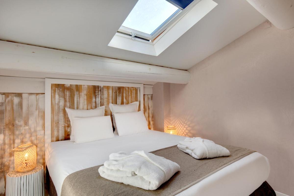 Un ou plusieurs lits dans un hébergement de l'établissement Vila De La Mar & Spa