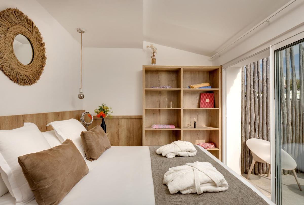 Un ou plusieurs lits dans un hébergement de l'établissement Vila De La Mar & Spa