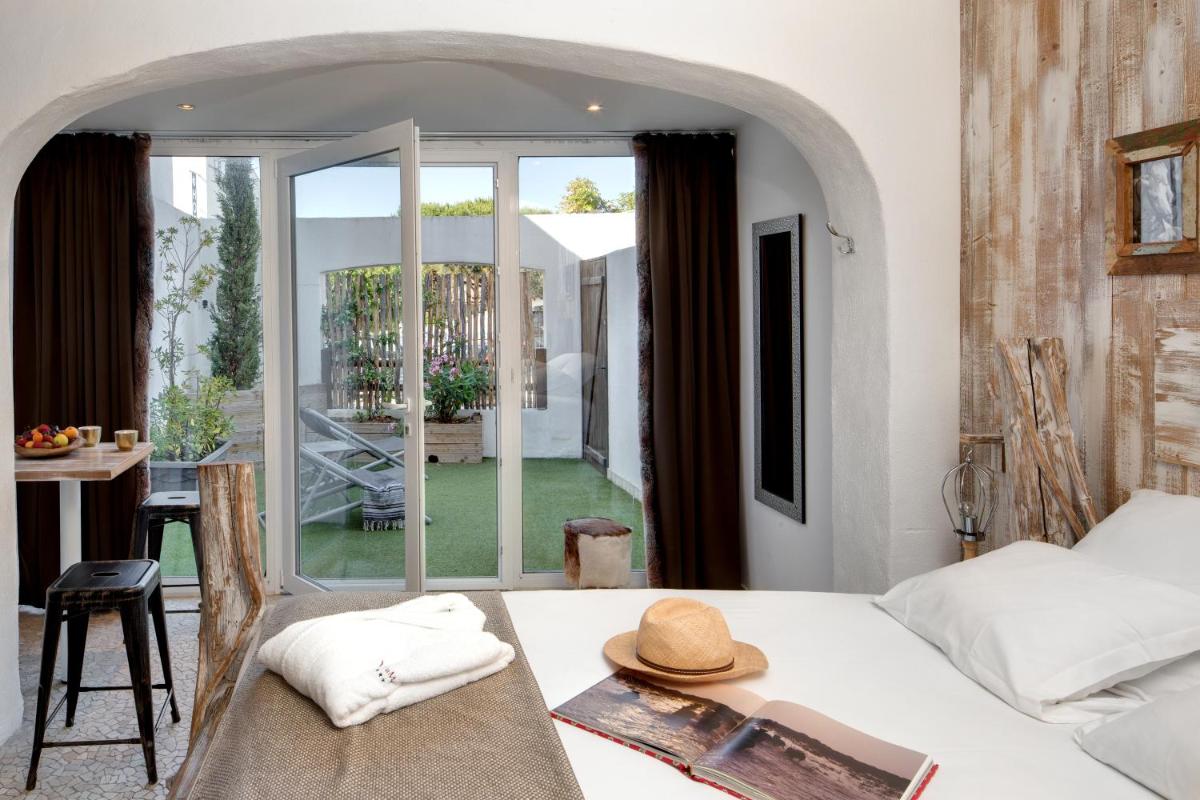 Un ou plusieurs lits dans un hébergement de l'établissement Vila De La Mar & Spa