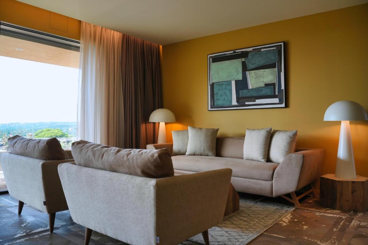 Coin salon dans l'établissement Les Regalia Hôtel & Spa