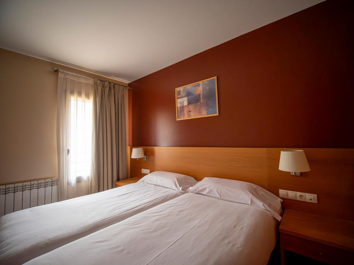 Cama o camas de una habitación en Aparthotel Siente Boí & SPA