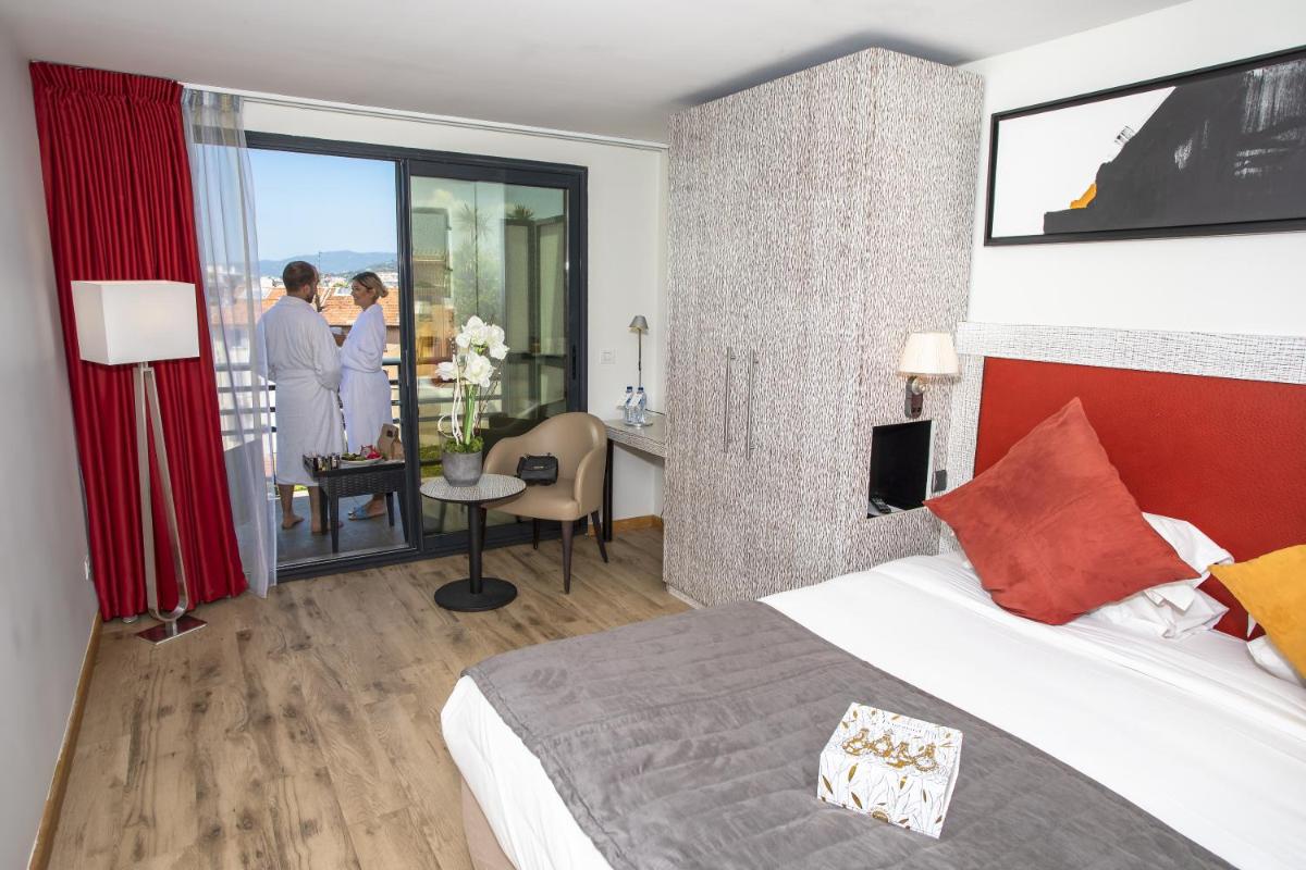 Un ou plusieurs lits dans un hébergement de l'établissement Eden Hotel & Spa