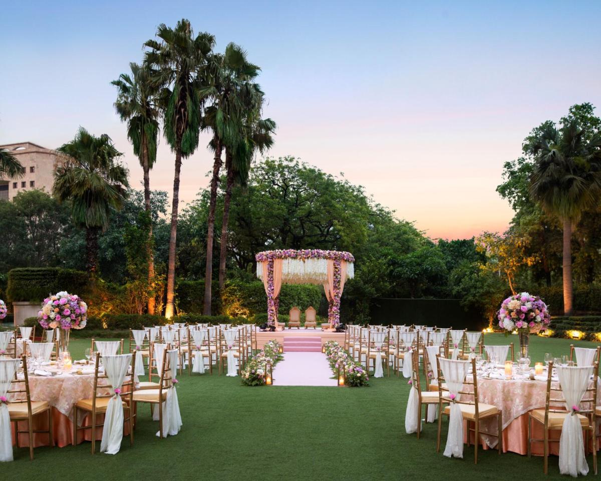 an outdoor wedding ceremony with chairs and a altar at Shangri-La Eros New Delhi in New Delhi an outdoor wedding ceremony with chairs and a altar at Shangri-La Eros New Delhi in New Delhi