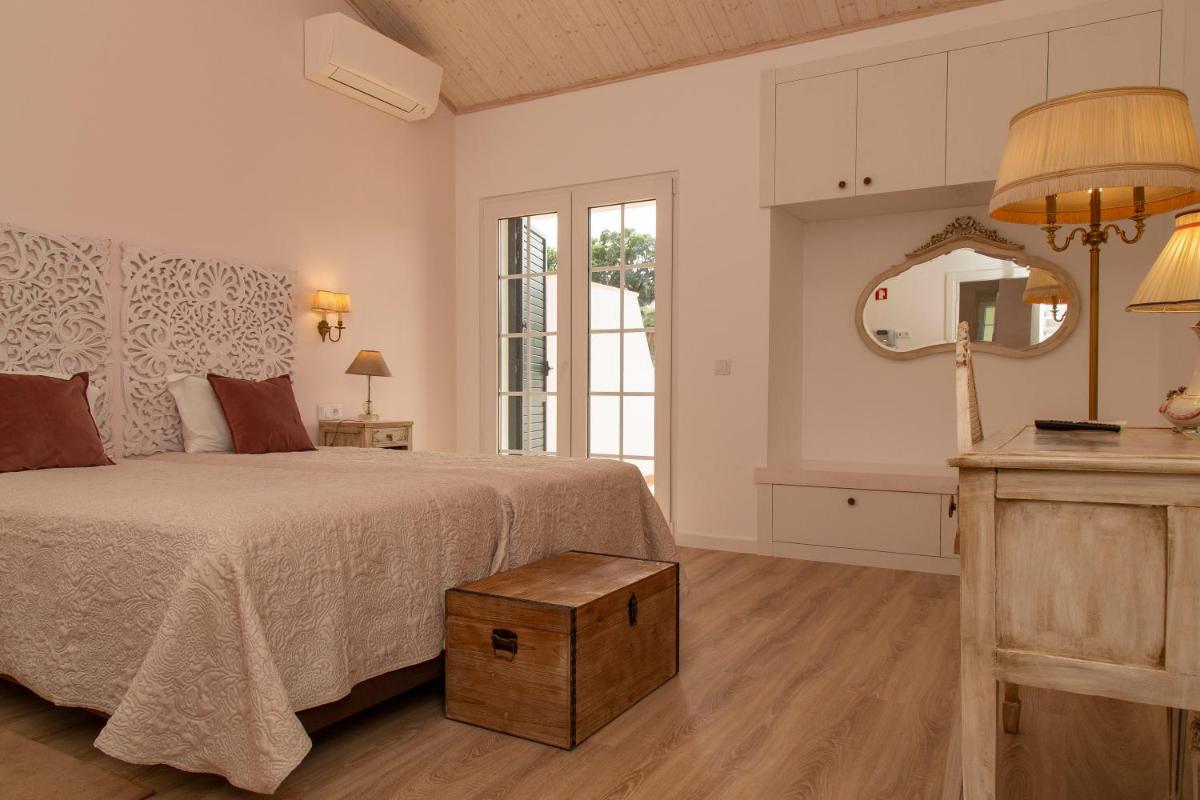 Uma cama ou camas num quarto em Aires da Serra Hotel