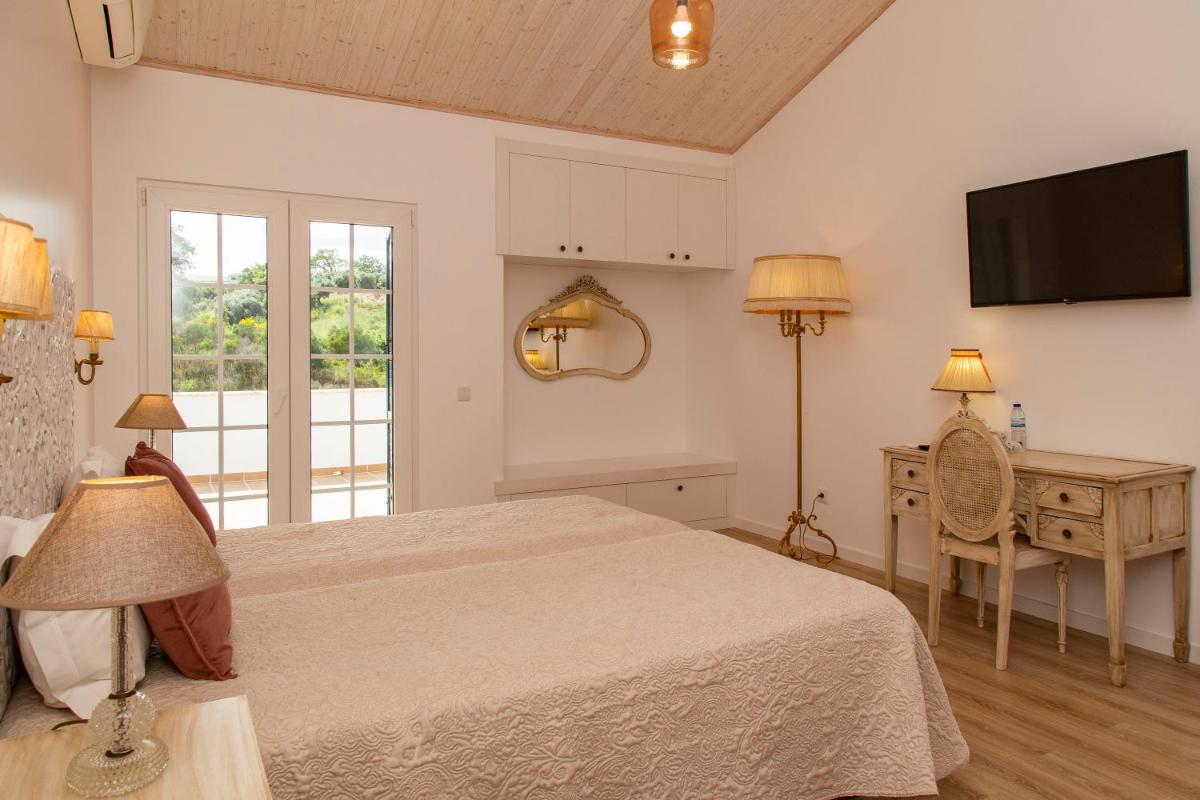 Uma cama ou camas num quarto em Aires da Serra Hotel