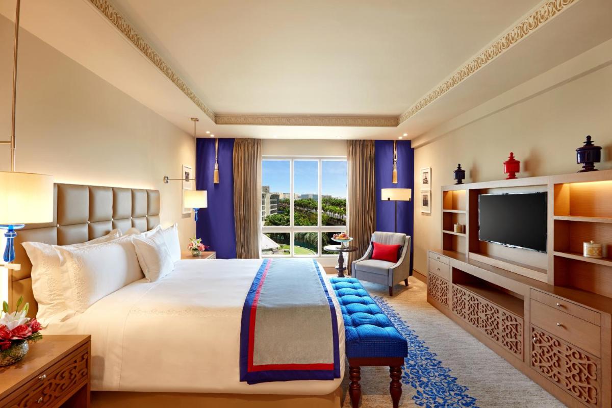 a bedroom with a large bed and a large window at ITC Maratha, a Luxury Collection Hotel, Mumbai in Mumbai
