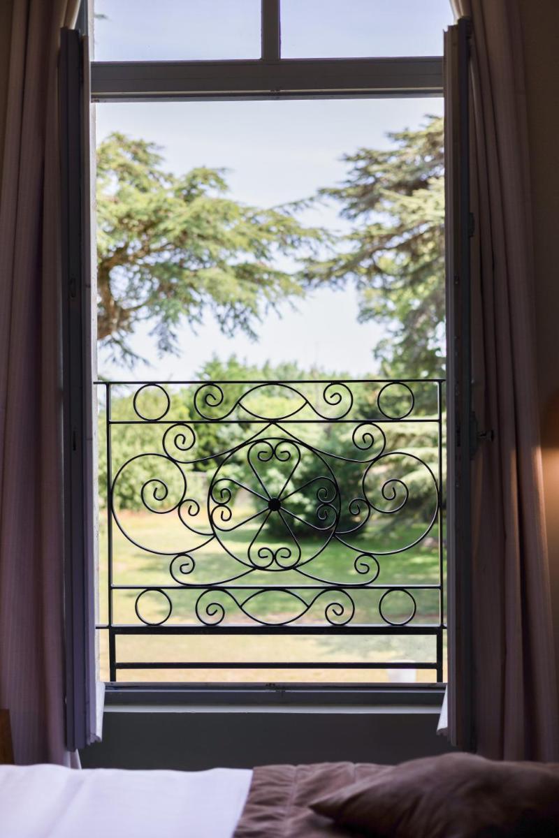 Balcon ou terrasse dans l'établissement Hôtel et SPA du Château