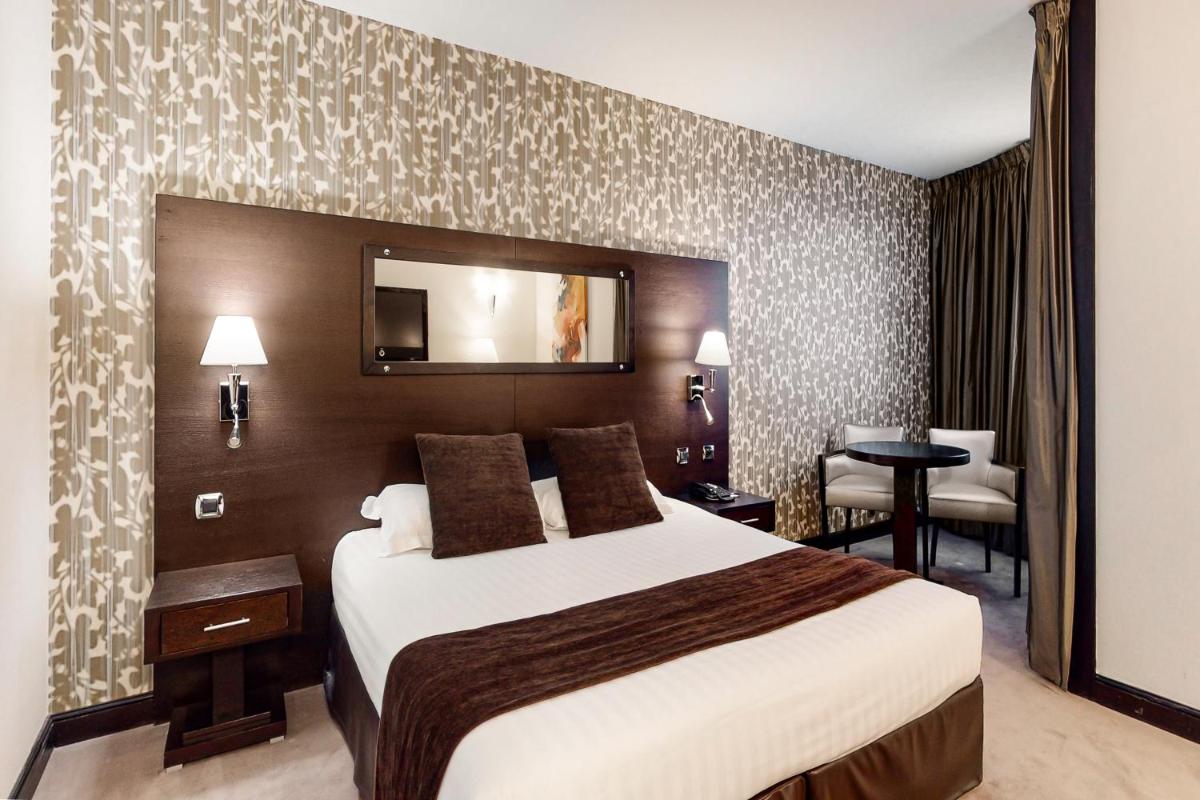 Un ou plusieurs lits dans un hébergement de l'établissement Hotel Palladia