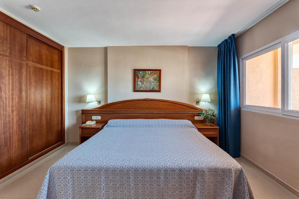 Cama o camas de una habitación en Bahía Tropical
