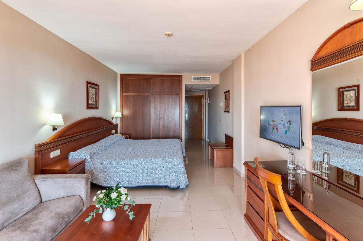 Cama o camas de una habitación en Bahía Tropical