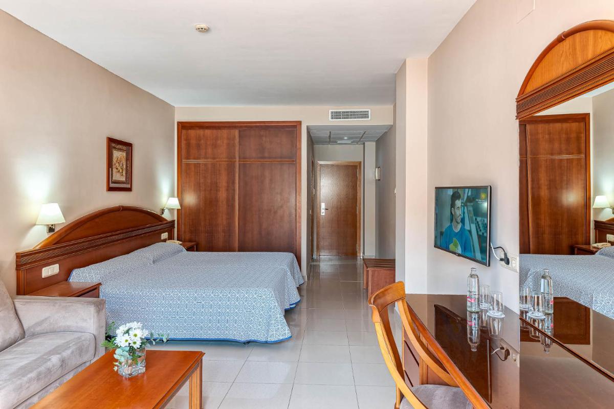 Cama o camas de una habitación en Bahía Tropical