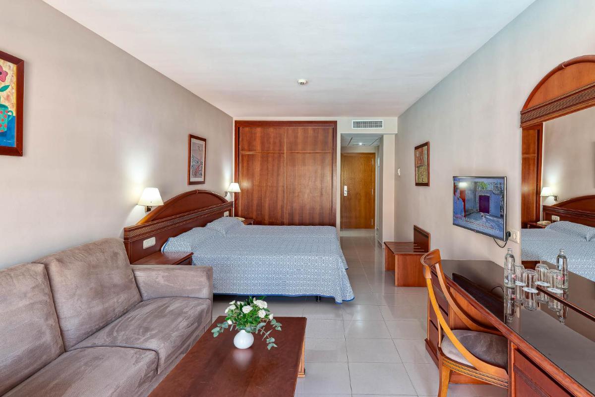 Cama o camas de una habitación en Bahía Tropical