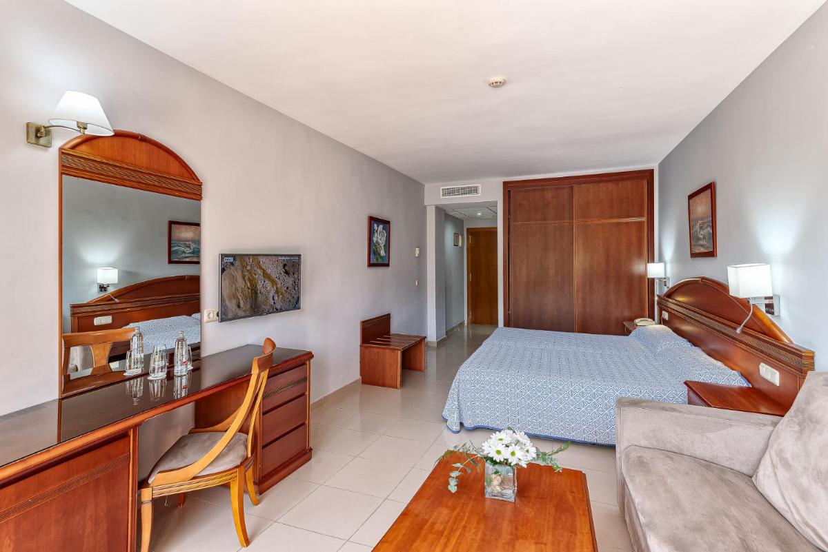 Cama o camas de una habitación en Bahía Tropical