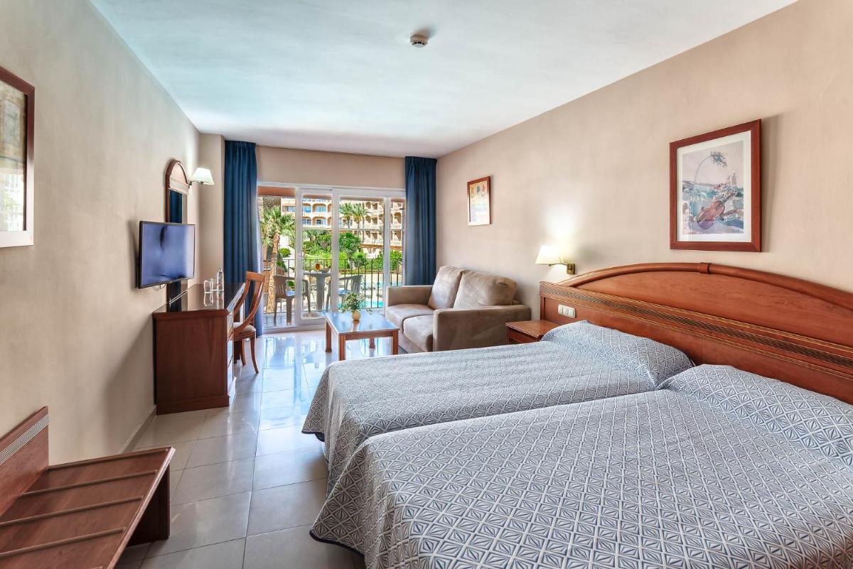 Cama o camas de una habitación en Bahía Tropical