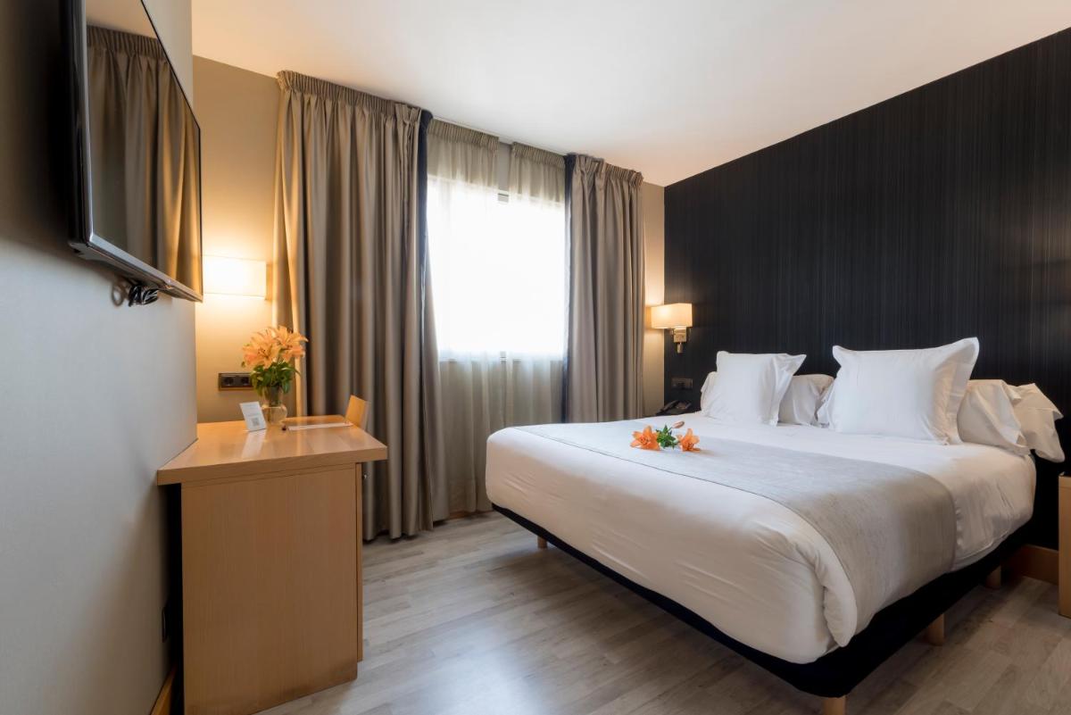 Cama o camas de una habitación en Hotel Plaza