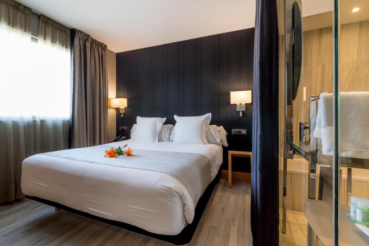 Cama o camas de una habitación en Hotel Plaza