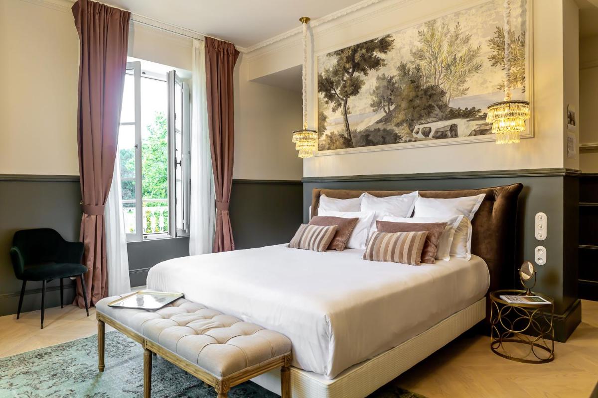 Un ou plusieurs lits dans un hébergement de l'établissement Château Léognan, Domaine viticole - proche Bordeaux
