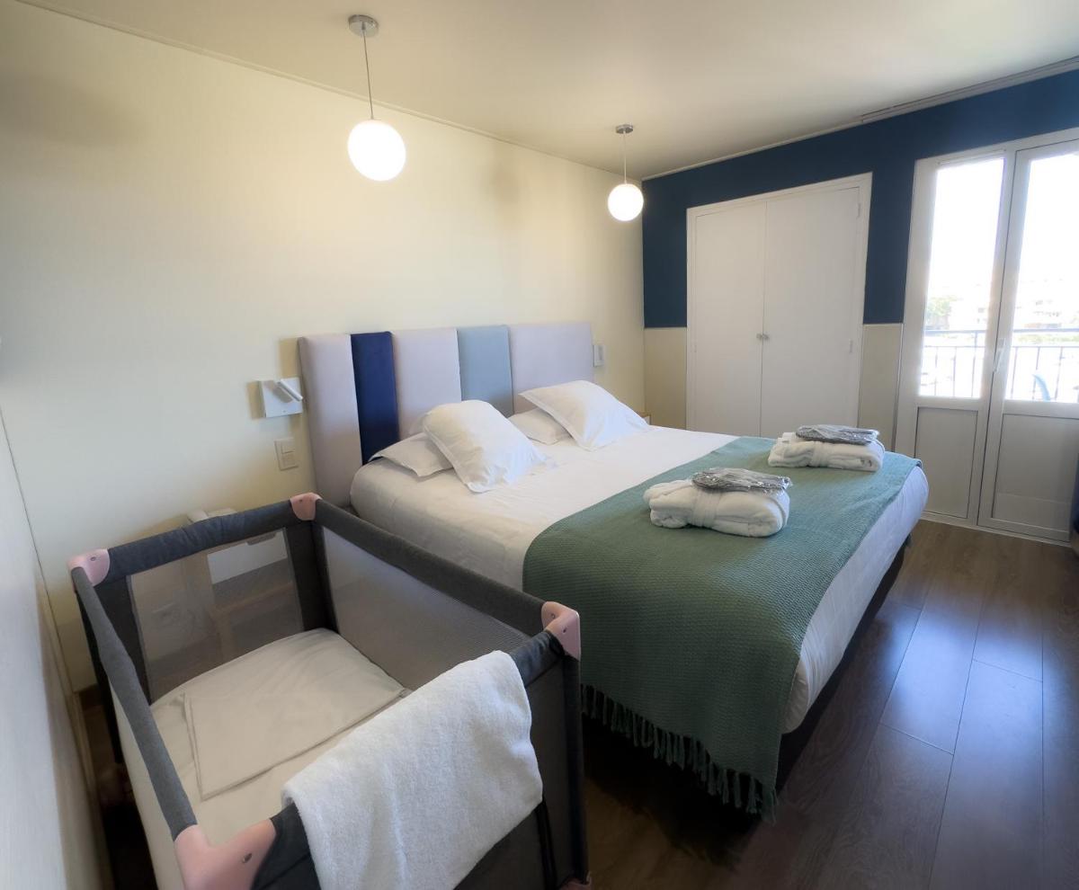 Un ou plusieurs lits dans un hébergement de l'établissement Ostella Spa & Resort