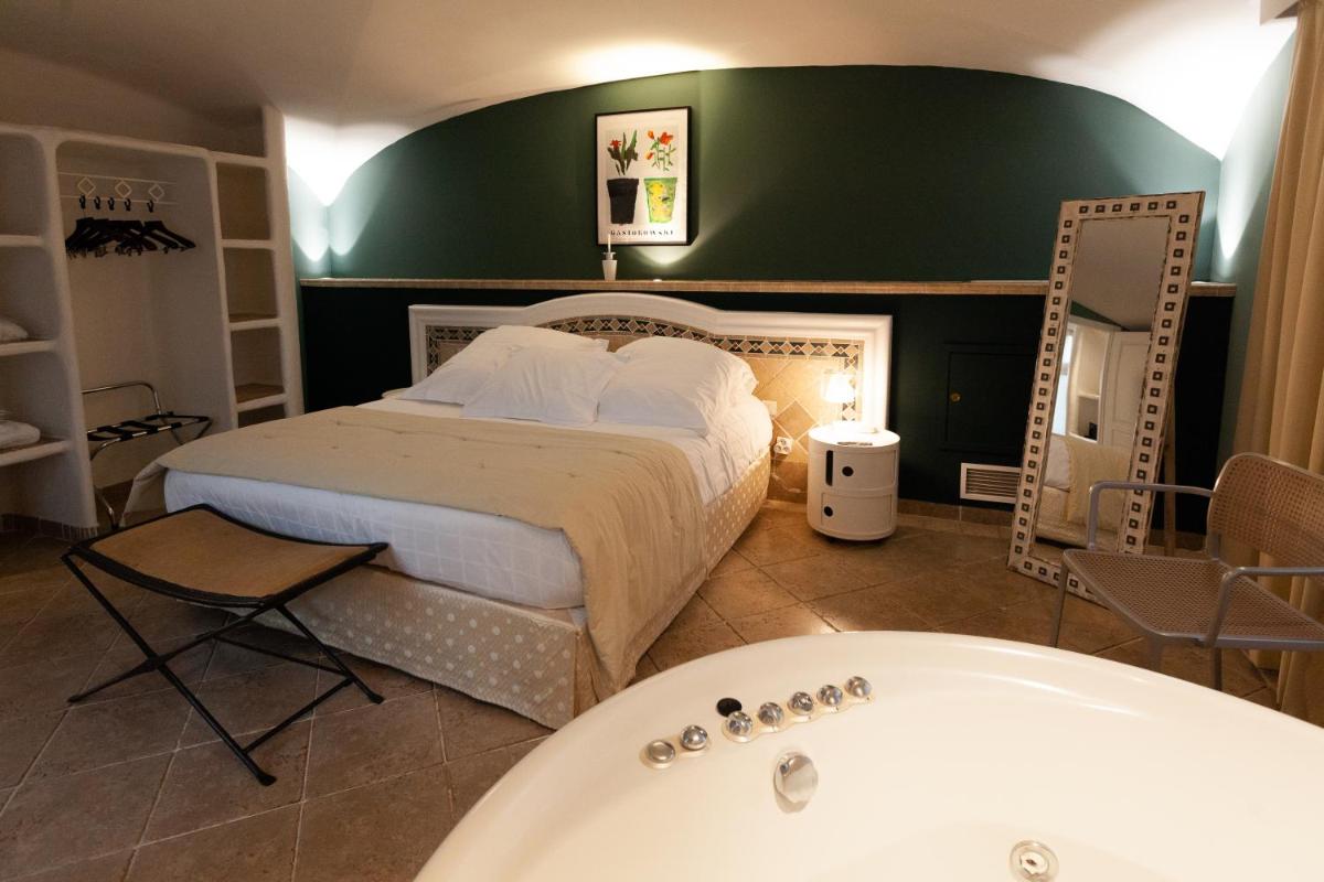 Un ou plusieurs lits dans un hébergement de l'établissement Ostella Spa & Resort